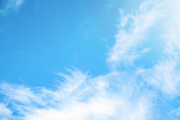 Blue sky background with light clouds on a clear day