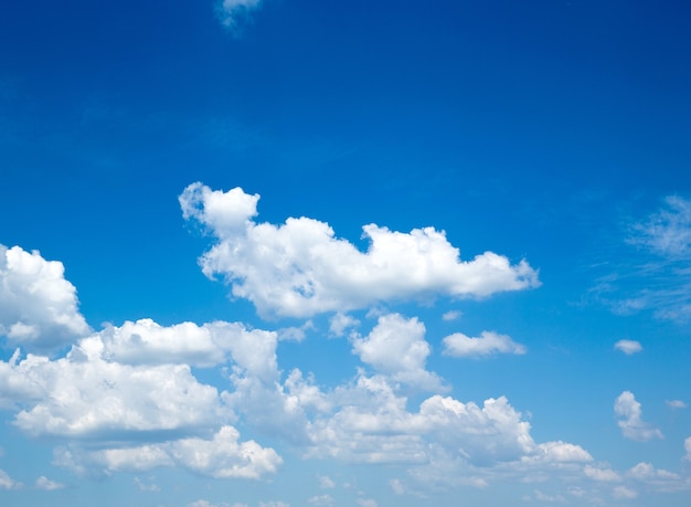 Blue sky background with a tiny clouds