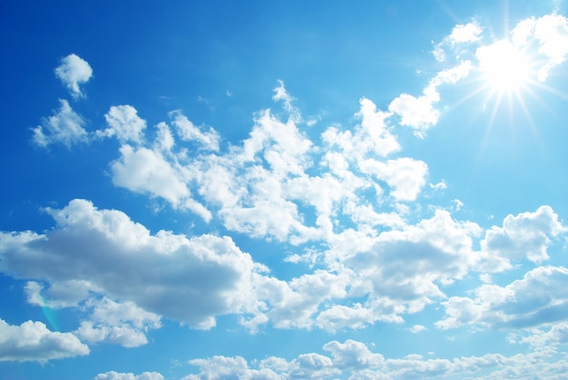 Blue sky background with tiny clouds