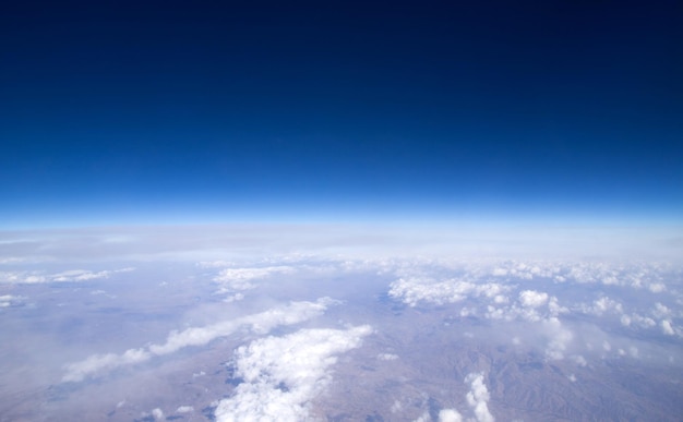 Blue sky background with tiny clouds