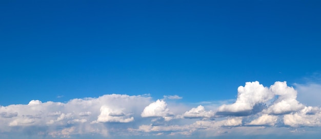 Blue sky background with tiny clouds