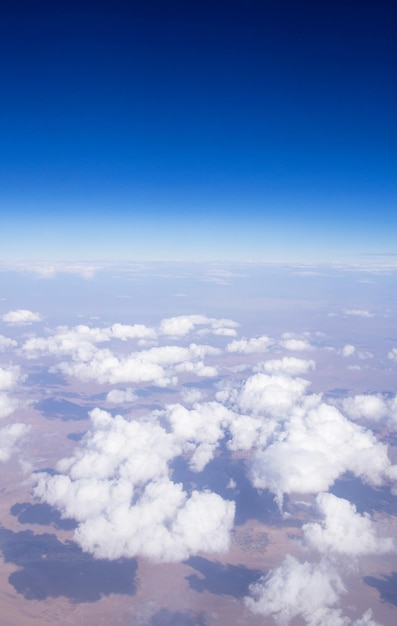 Blue sky background with tiny clouds