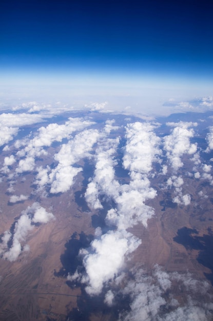 Blue sky background with tiny clouds