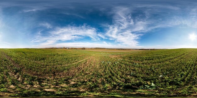 Blue sky before sunset with beautiful awesome clouds full\
seamless spherical hdri panorama 360 degrees angle view among\
fields in evening in equirectangular projection ready for vr ar\
content