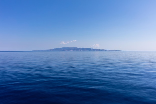 Blue sky and calm ocean sea water background