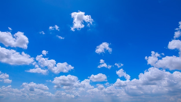 Blue sky in clear sunny day with white clouds.