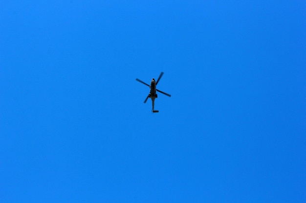 Blue sky and military helicopter