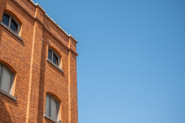 blue sky old red brick wall windows part residential