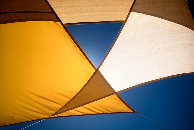 Blue sky and textile awning full sun