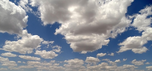 Blue sky and white cloud clustersclouds of interesting shapescloudy sky