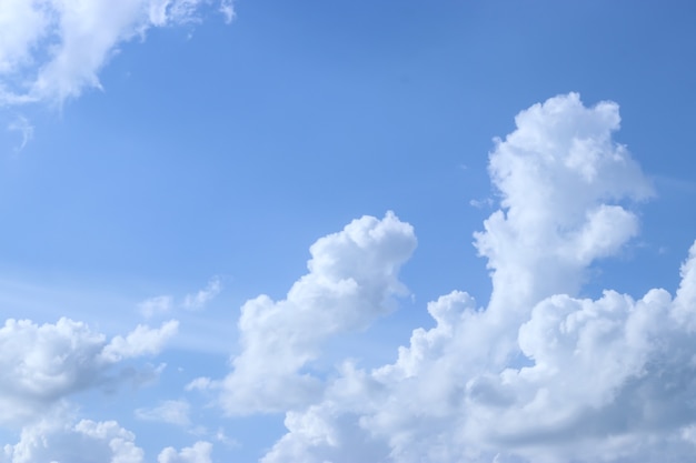 Blue sky white clouds. Puffy fluffy white clouds.