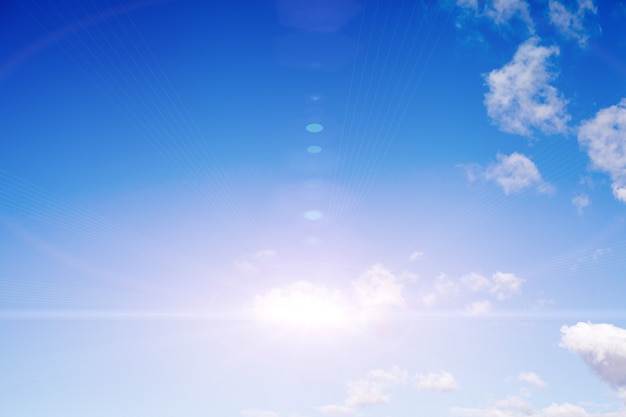 Blue sky with clouds and bright sunlight. High quality photo