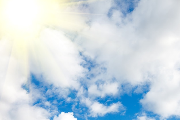 Blue sky with clouds and bright sunlight. High quality photo