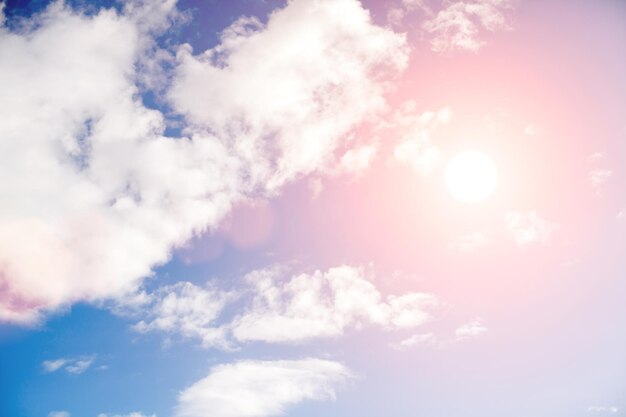 Blue sky with clouds and bright sunlight. High quality photo