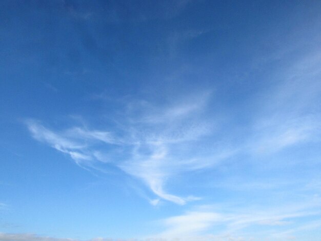 A blue sky with clouds and a few clouds