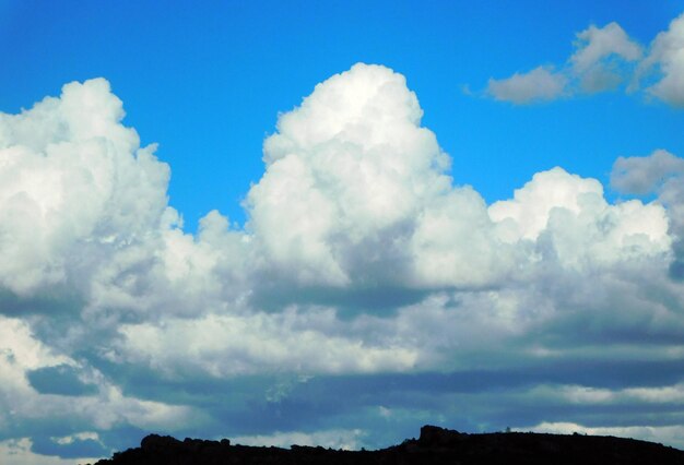 A blue sky with clouds in the foreground