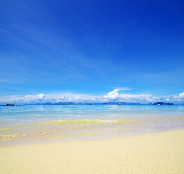 Blue sky with clouds and sun