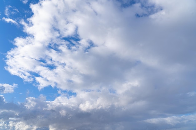 A blue sky with clouds and a white cloud