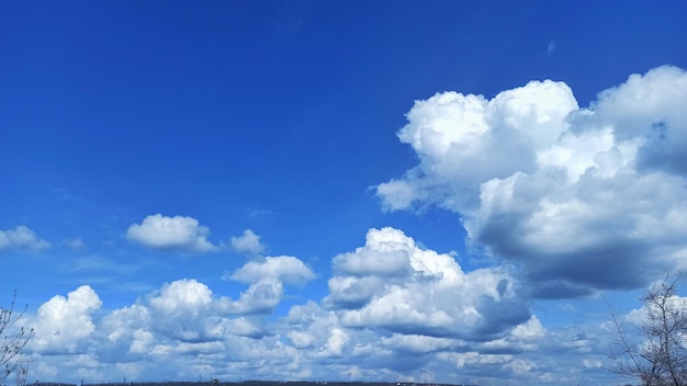 A blue sky with clouds and a white cloud