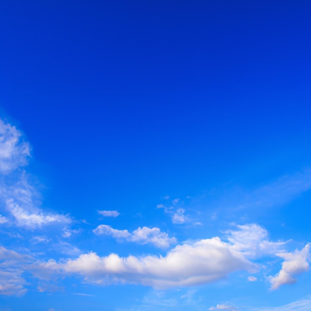 A blue sky with clouds and a white cloud