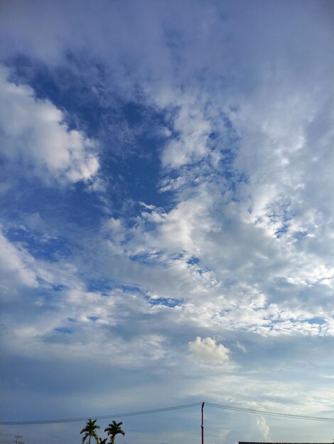 A blue sky with clouds and the word cloud on it