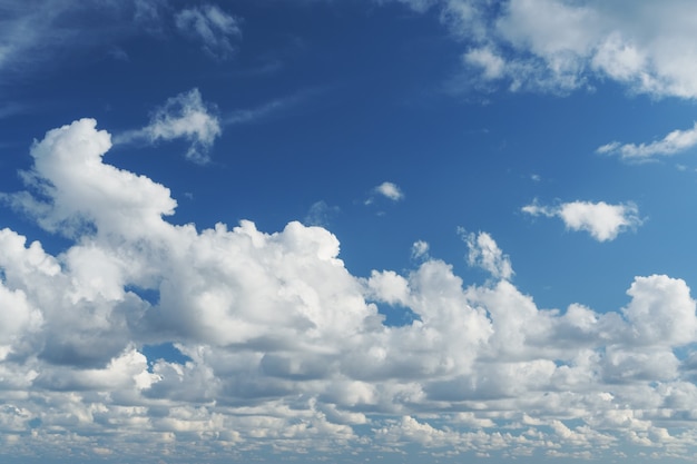 Blue sky with cumulus clouds over the sea