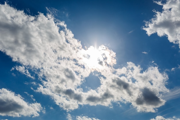 Blue sky with large white clouds, sunny, processing HDR