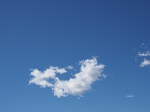 Blue sky with lonely clouds