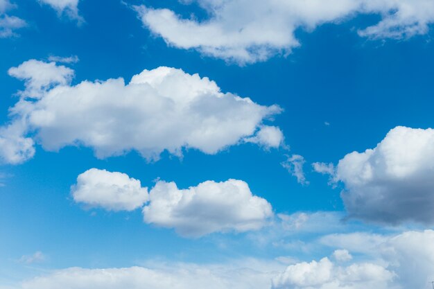 Blue sky with white and gray clouds.