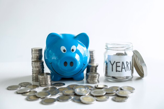 Blue smiling piggy bank and savings.