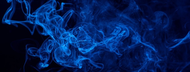 Blue smoke on a black background