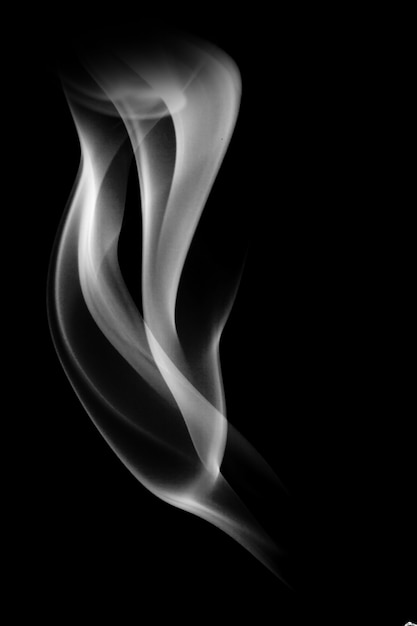 Photo blue smoke isolated on a black background. template for design