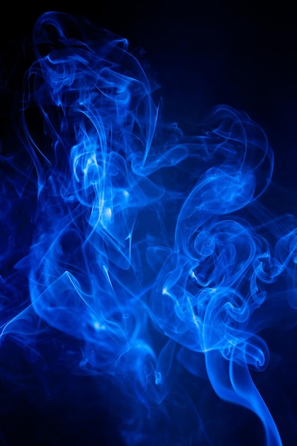 Blue smoke motion on black background