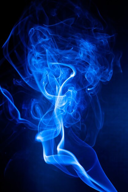 Blue smoke motion on black.