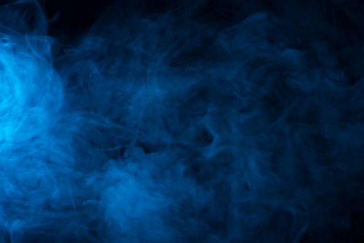 Photo blue smoke texture on a black background