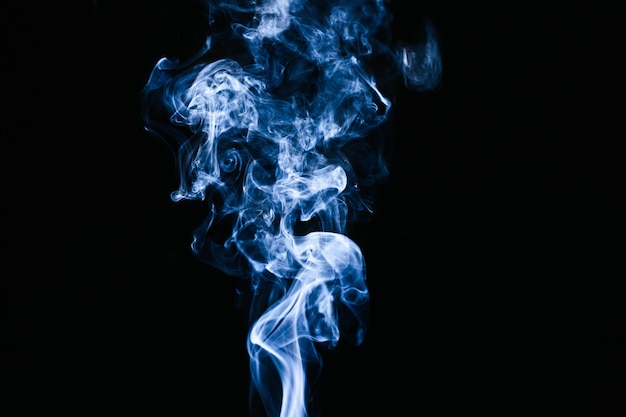 Blue smoke waves on black background