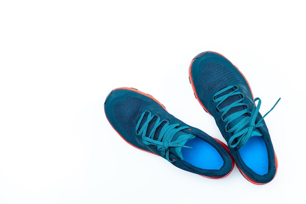 Blue sneakers on a white isolated background