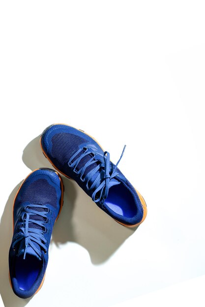 Blue sneakers on a white isolated background