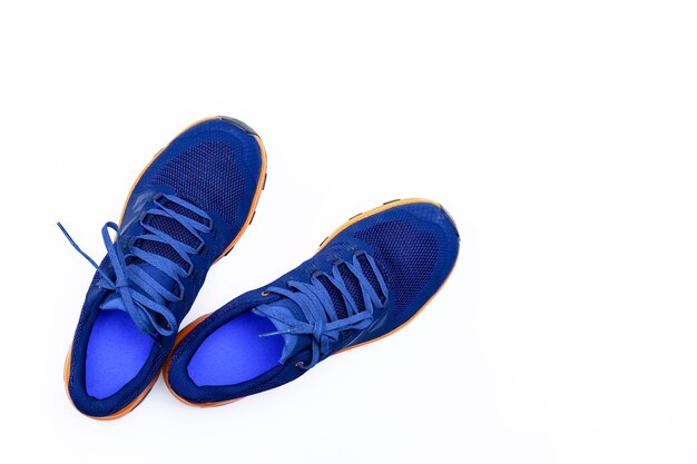 Blue sneakers on a white isolated background