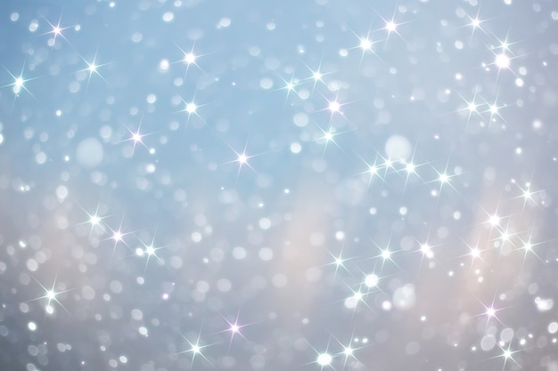 Blue snowfall bokeh background, abstract snowflake background blurred abstract blue