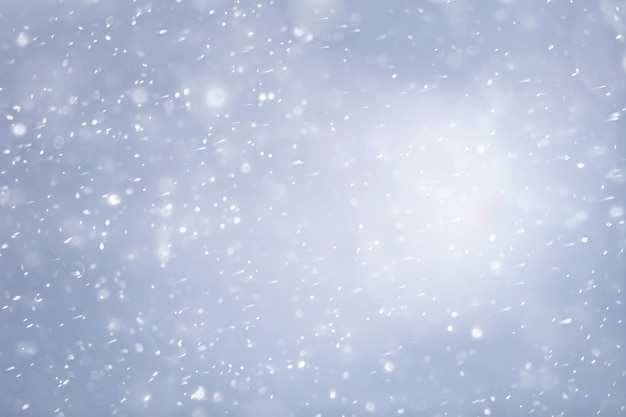 blue snowfall bokeh background, abstract snowflake background on blurred abstract blue