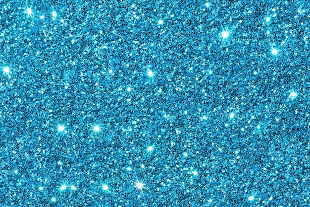 Blue sparkle. Glitter background. Holiday blurred background