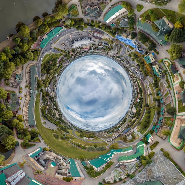 Blue sphere inside overlooking old town urban development historic buildings and crossroads with cars Transformation of spherical 360 panorama in abstract aerial view