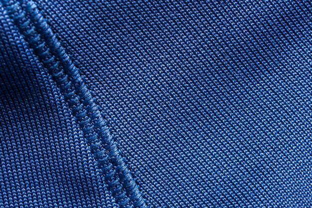 Foto abbigliamento sportivo in tessuto blu camicia da calcio maglia texture con cuciture