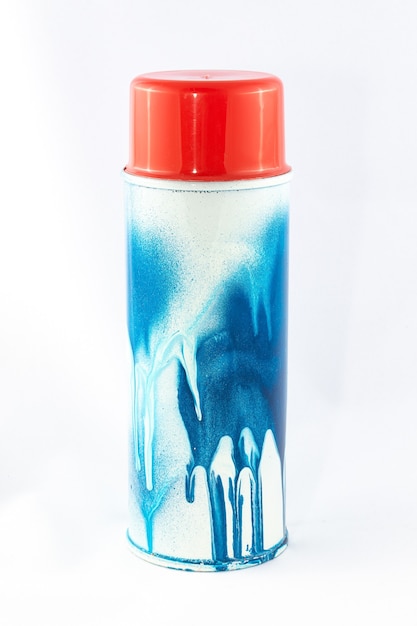 Blue spray paint can on white background