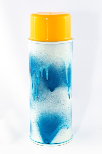 Blue spray paint can on white background