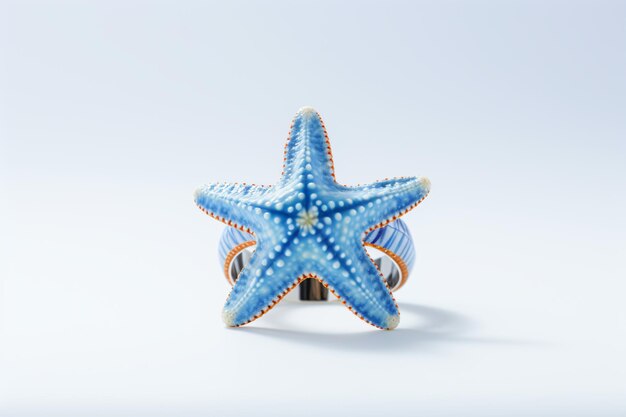 a blue starfish sitting on top of a white surface