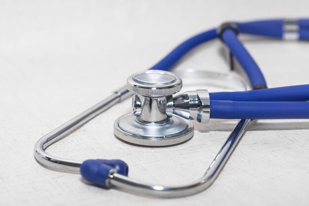 A blue stethoscope is on the desk