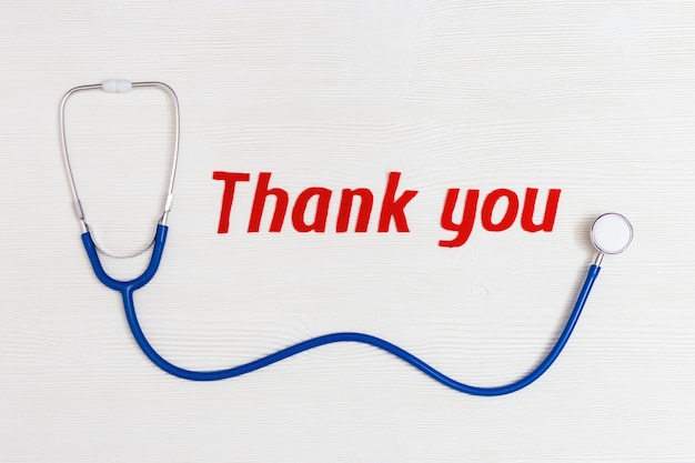 Blue stethoscope and red thank you text