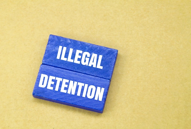 blue stick with the word illegal detention